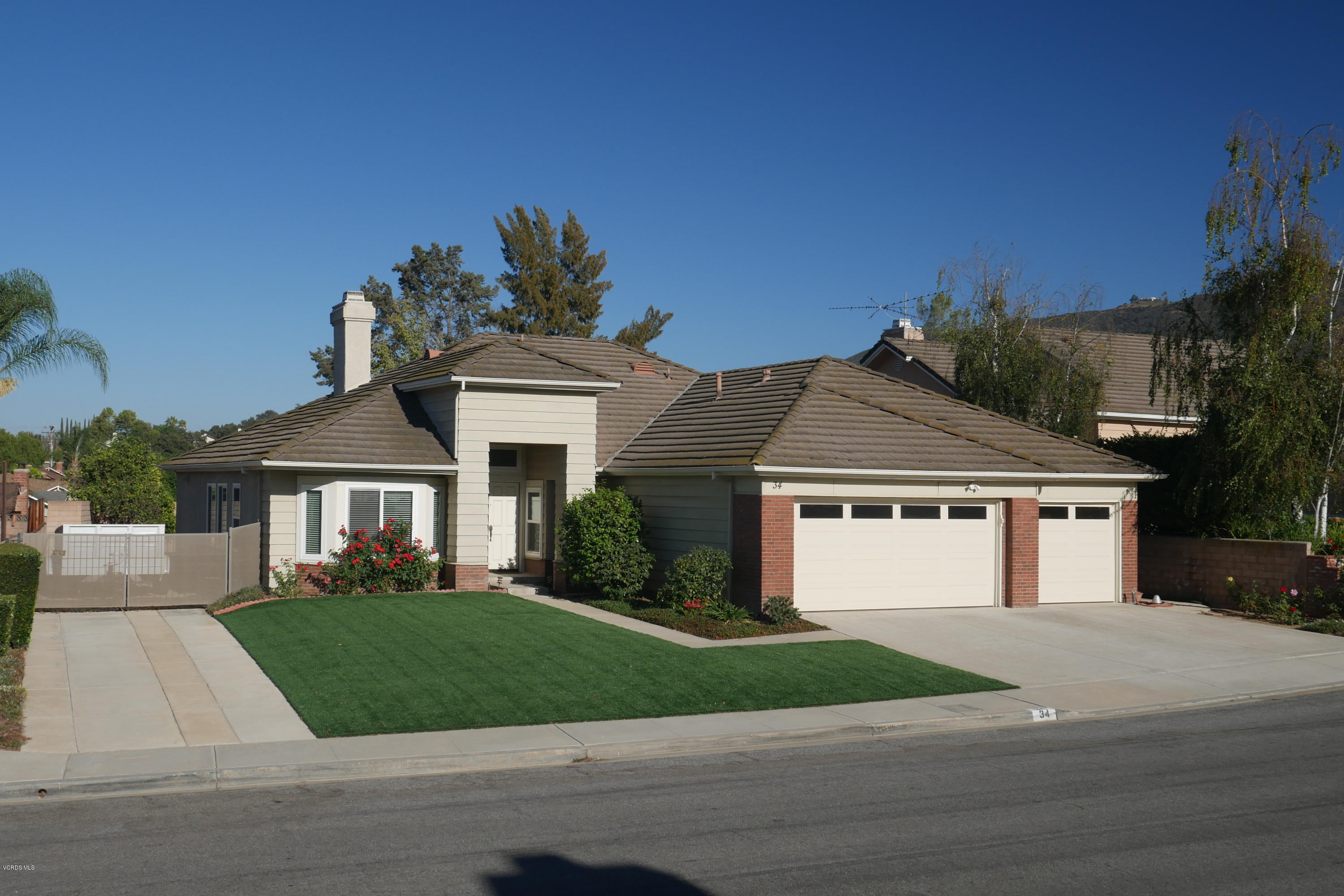 34 South Madrid Avenue Newbury Park, CA 91320 - Photo 2 of 31 front view of a house and a yard