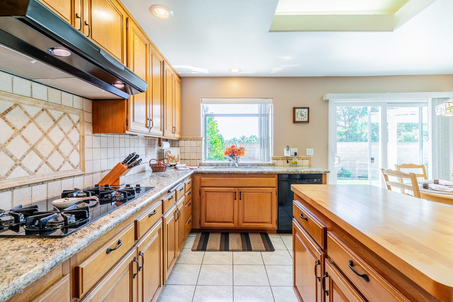 34 South Madrid Avenue Newbury Park, CA 91320 - Photo 11 of 31 a kitchen with stainless steel appliances a sink window and cabinets