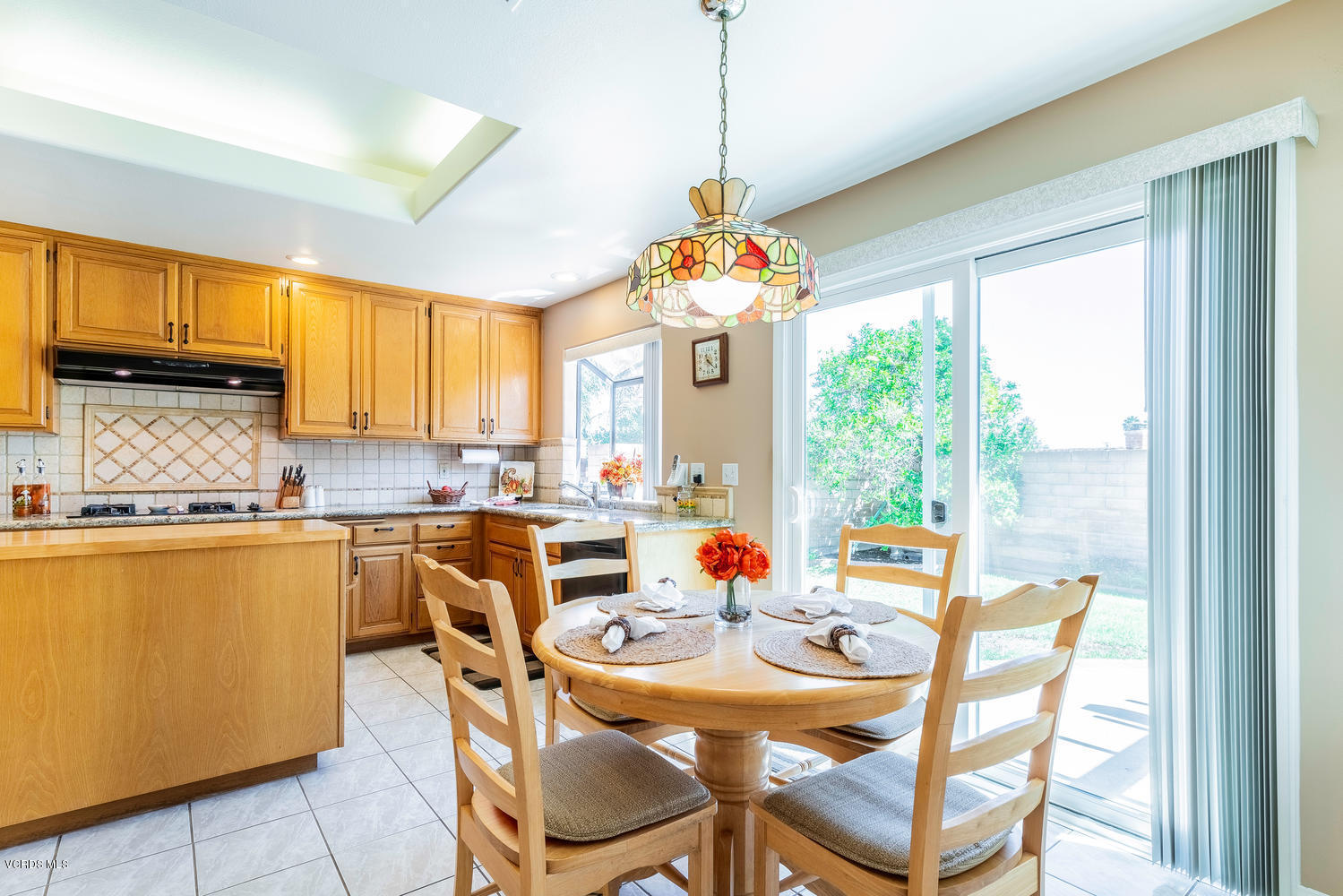 34 South Madrid Avenue Newbury Park, CA 91320 - Photo 13 of 31 a dining room filled counter top space a dining table and a window