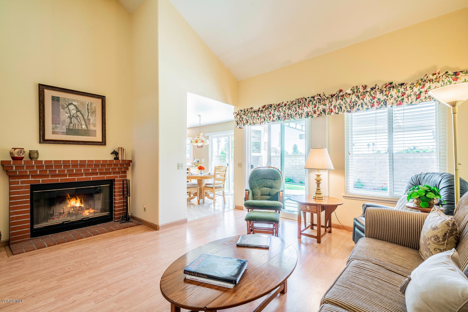 34 South Madrid Avenue Newbury Park, CA 91320 - Photo 15 of 31 a living room with furniture a large window and a fireplace