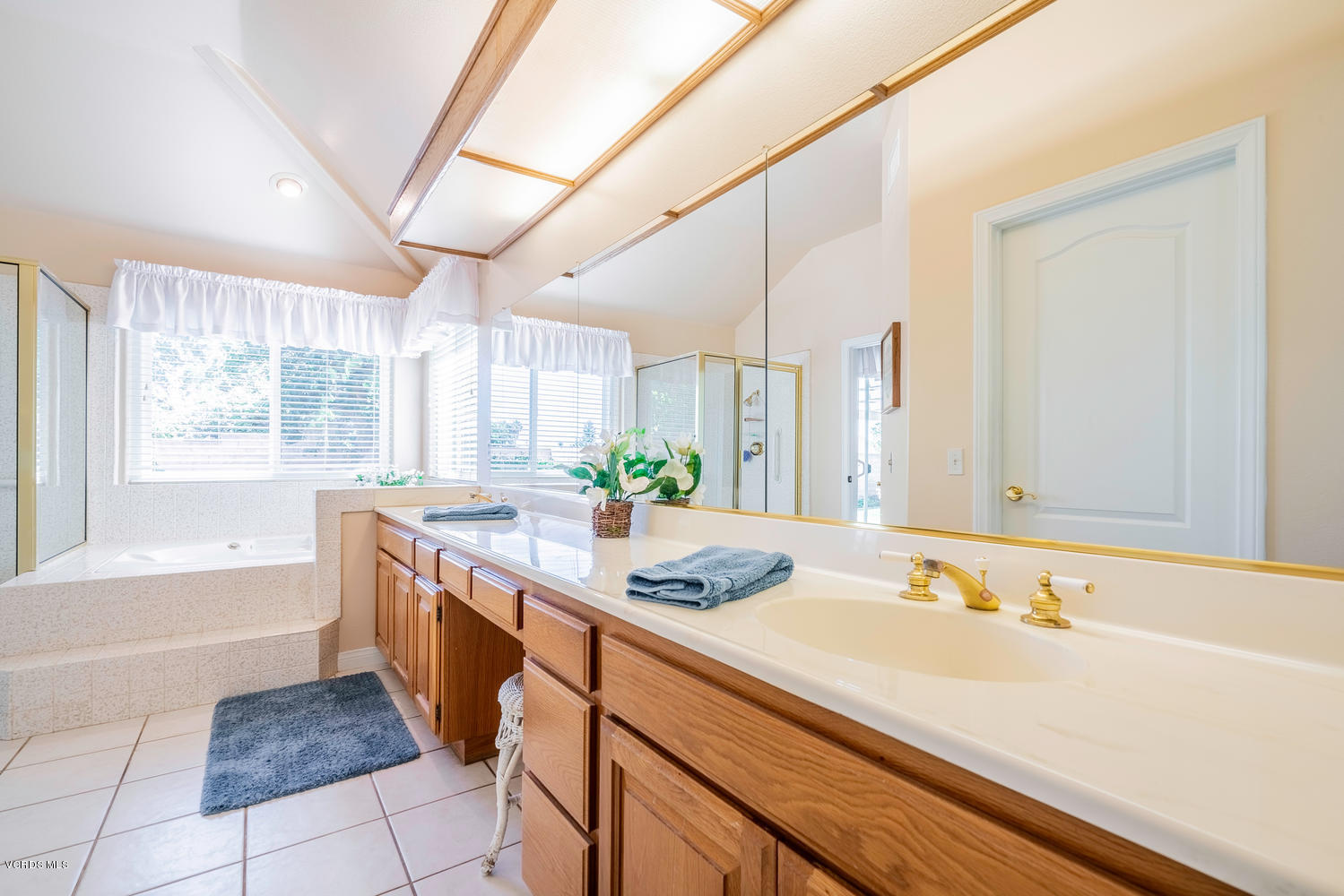 34 South Madrid Avenue Newbury Park, CA 91320 - Photo 18 of 31 a bathroom with a granite countertop sink and a bathtub