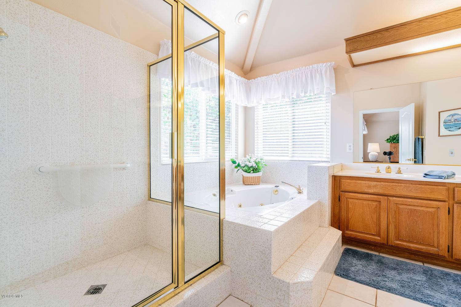 34 South Madrid Avenue Newbury Park, CA 91320 - Photo 19 of 31 a bathroom with a tub sink and mirror