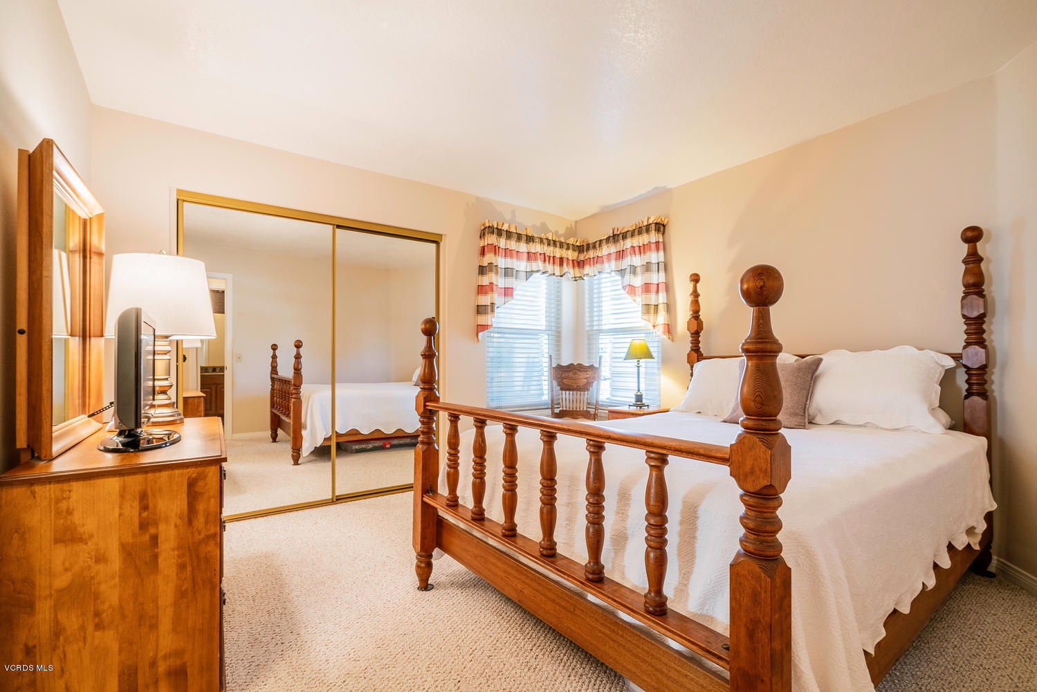 34 South Madrid Avenue Newbury Park, CA 91320 - Photo 20 of 31 a bed room with a bed and a large window