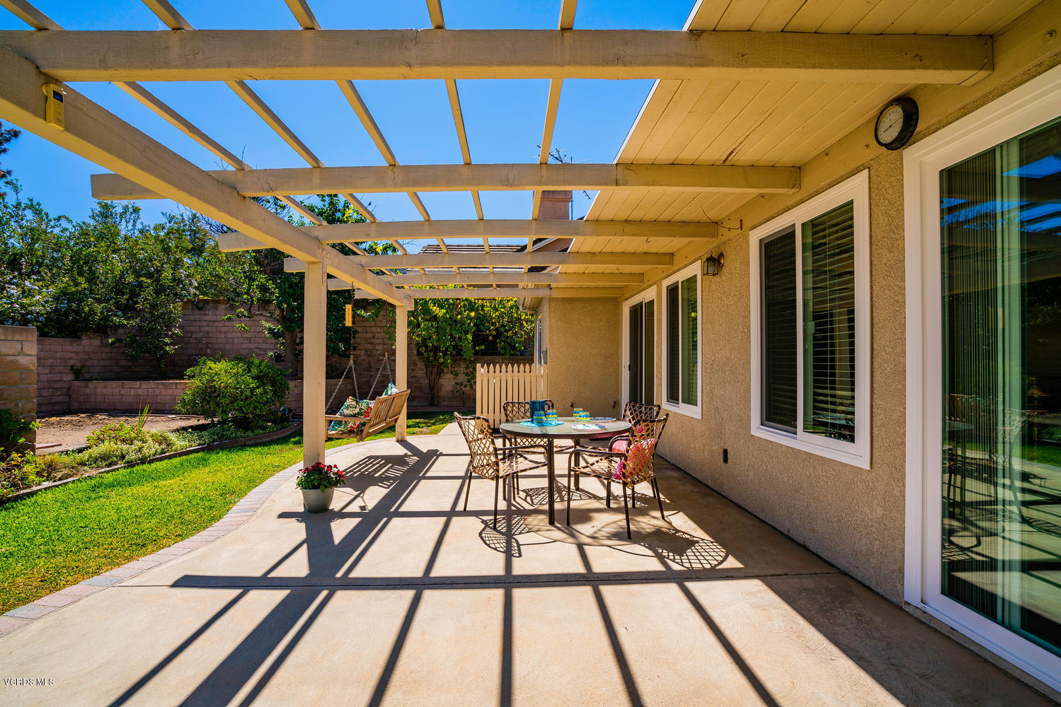 34 South Madrid Avenue Newbury Park, CA 91320 - Photo 27 of 31 a view of porch with a table and chairs and potted plants