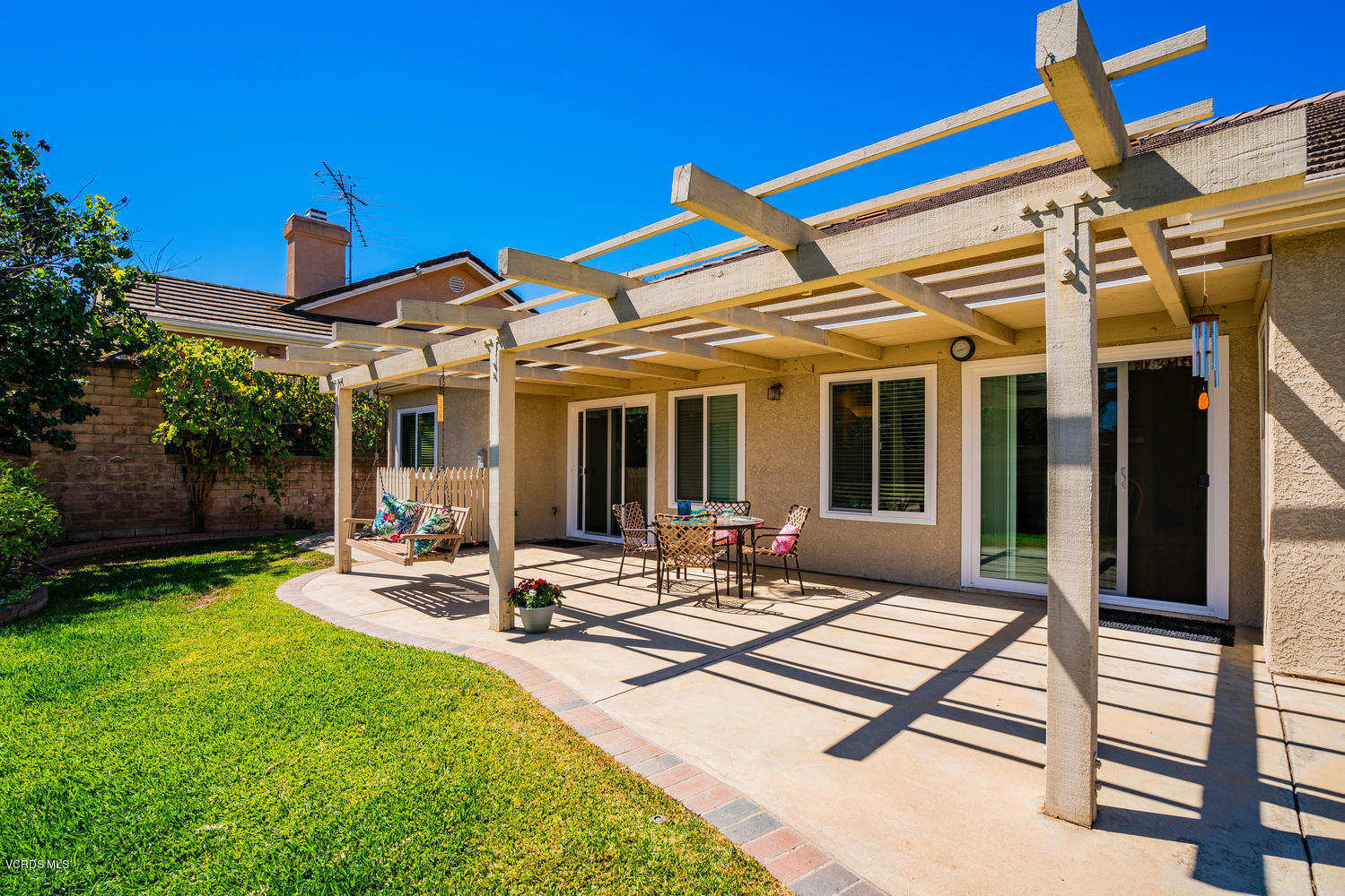 34 South Madrid Avenue Newbury Park, CA 91320 - Photo 28 of 31 a view of a patio with table and chairs with wooden floor and fence
