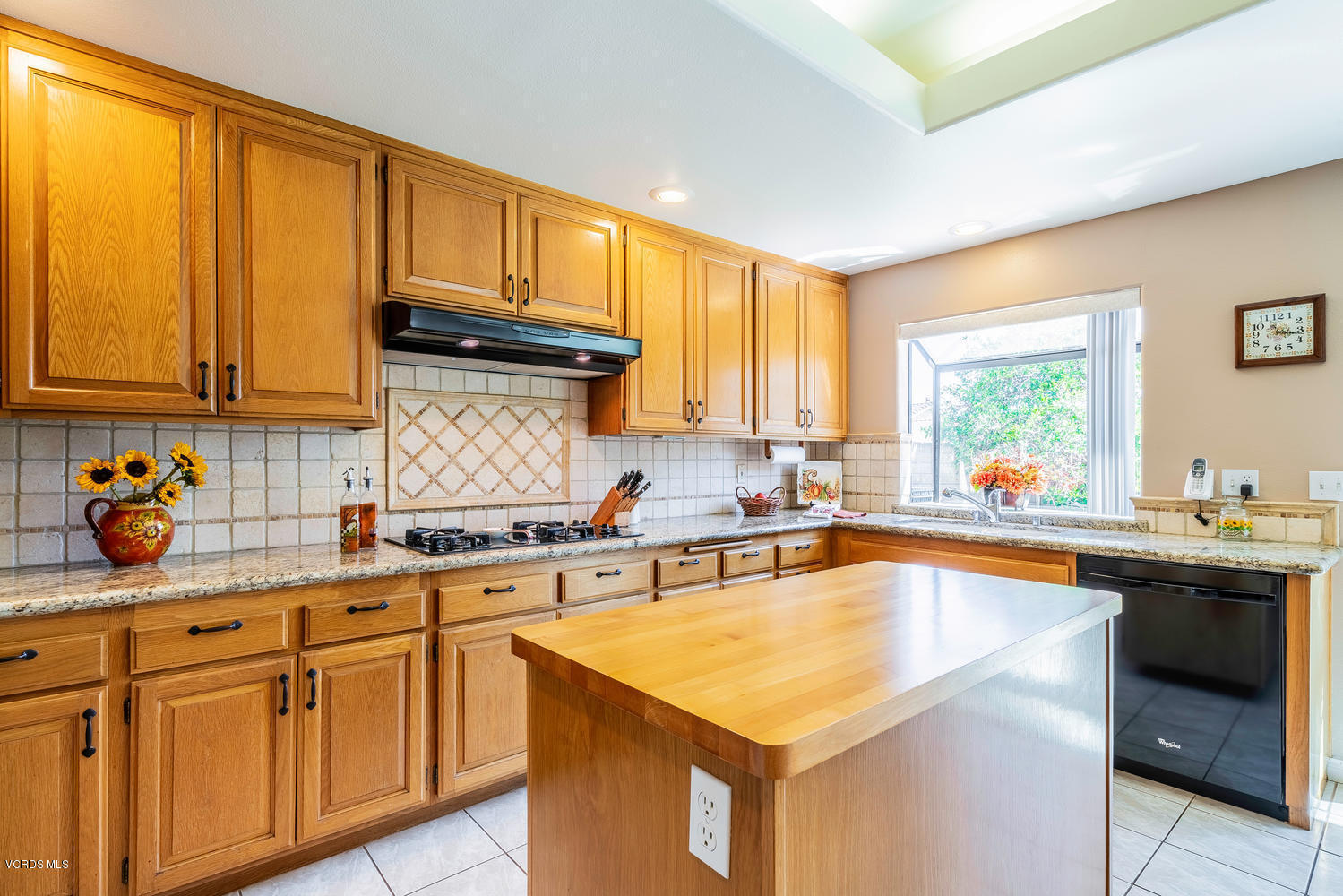 34 South Madrid Avenue Newbury Park, CA 91320 - Photo 8 of 31 a kitchen with stainless steel appliances granite countertop a sink a stove and cabinets