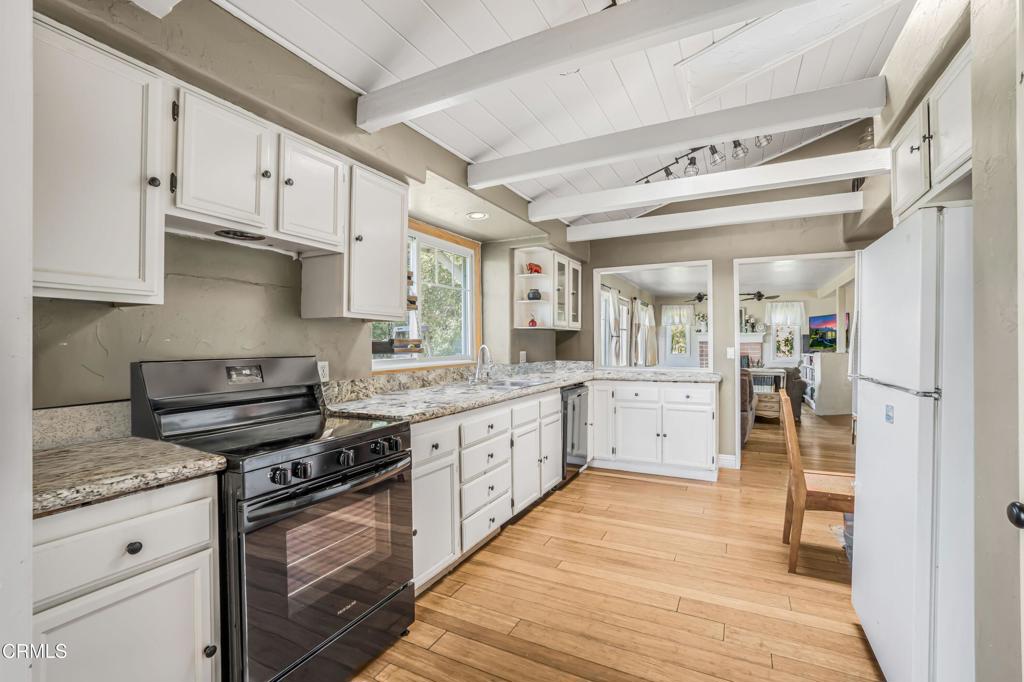 20176 South Mountain Road Santa Paula, CA 93060 - Photo 12 of 43 a kitchen with granite countertop cabinets stainless steel appliances and a counter space