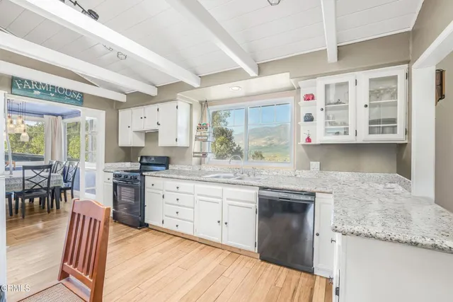 a room with a window and ceiling fan