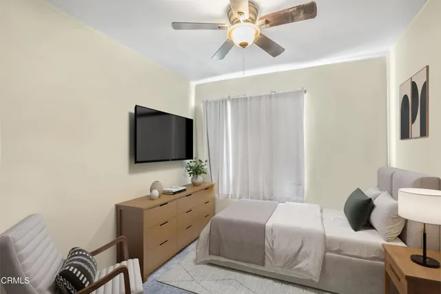a bathroom with a sink a toilet and a large mirror