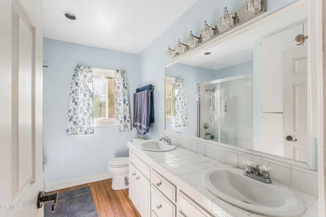 a bathroom with a glass shower door