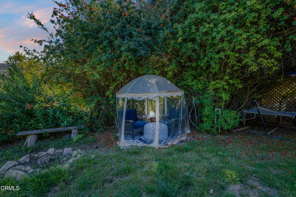 20176 South Mountain Road Santa Paula, CA 93060 - Photo 26 of 43 a view of a chair and table under an umbrella
