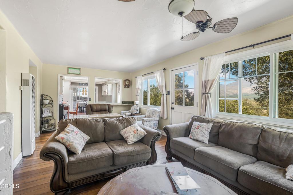 20176 South Mountain Road Santa Paula, CA 93060 - Photo 6 of 43 a living room with furniture ceiling fan and a window