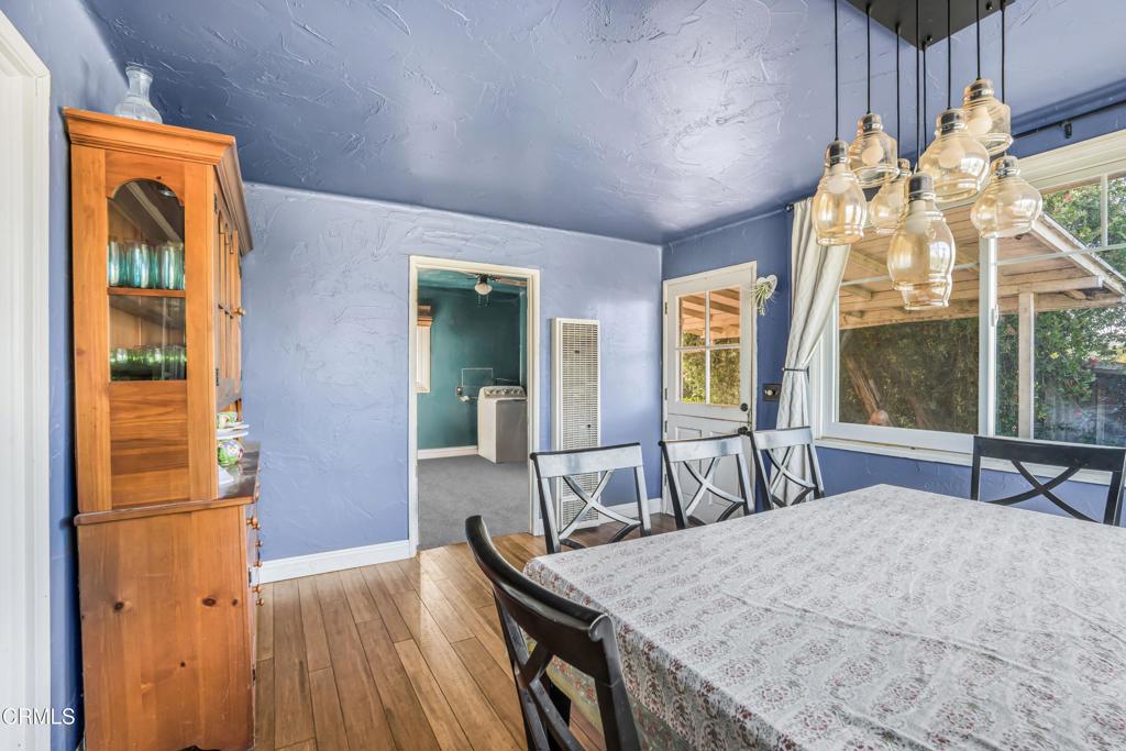 20176 South Mountain Road Santa Paula, CA 93060 - Photo 10 of 43 a view of a dining room with furniture and wooden floor
