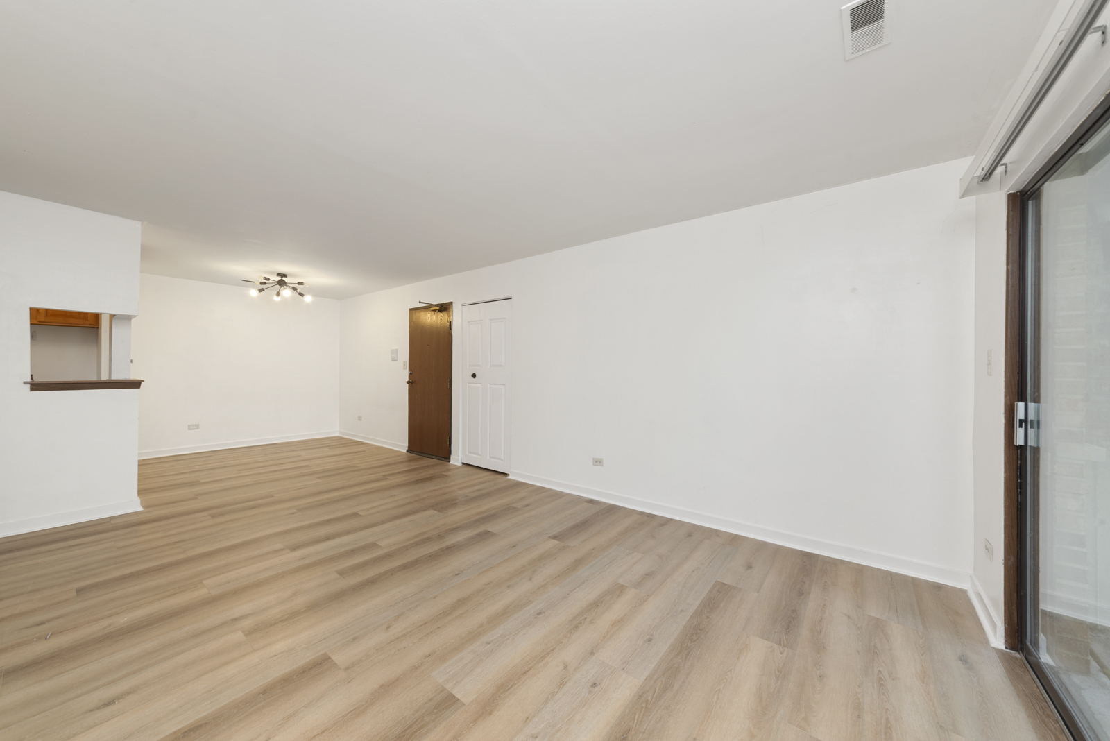 1420 Stonebridge Circle, Unit N3 Wheaton, IL 60189 - Photo 2 of 12 a view of an empty room with wooden floor