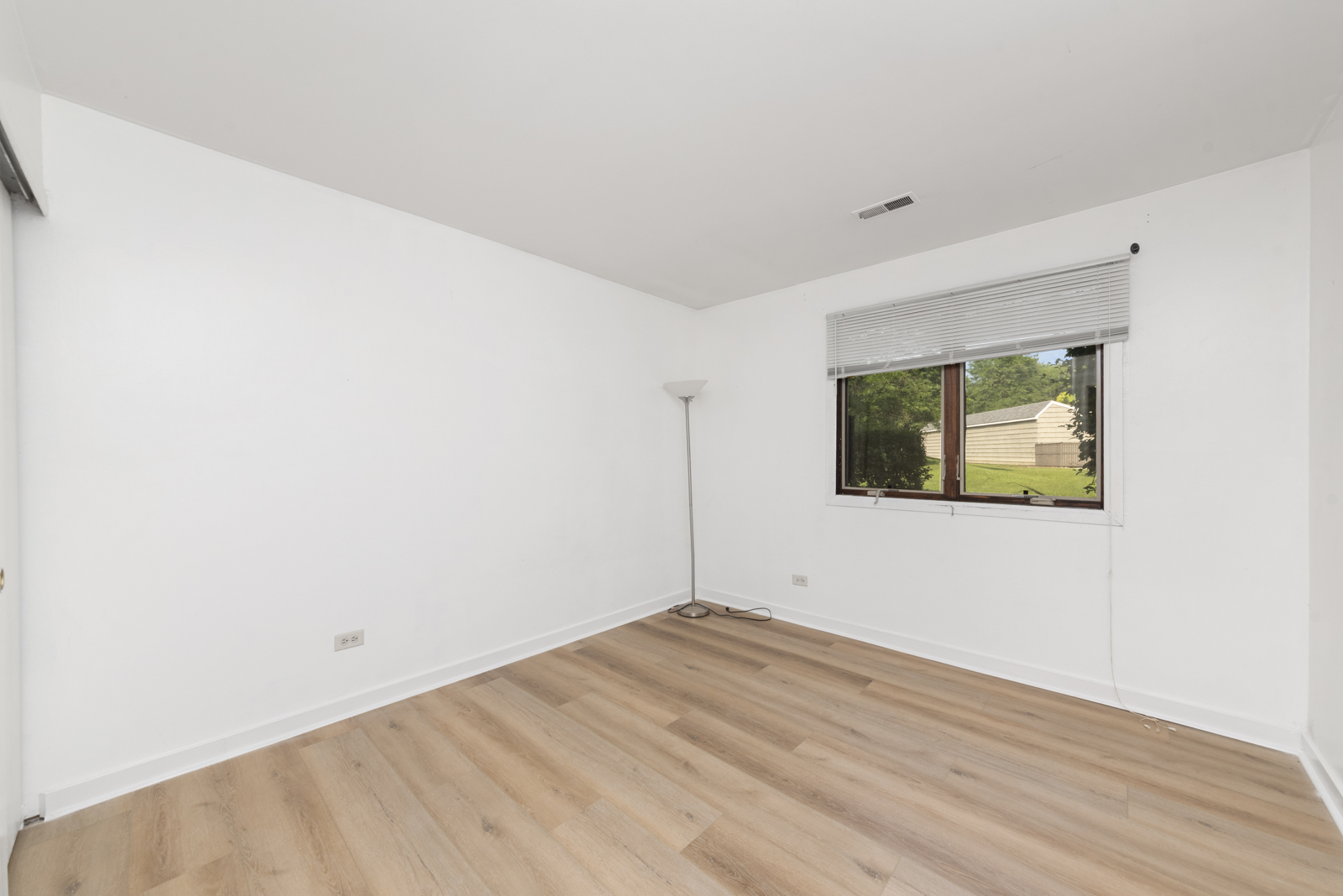 1420 Stonebridge Circle, Unit N3 Wheaton, IL 60189 - Photo 8 of 12 a view of empty room with wooden floor
