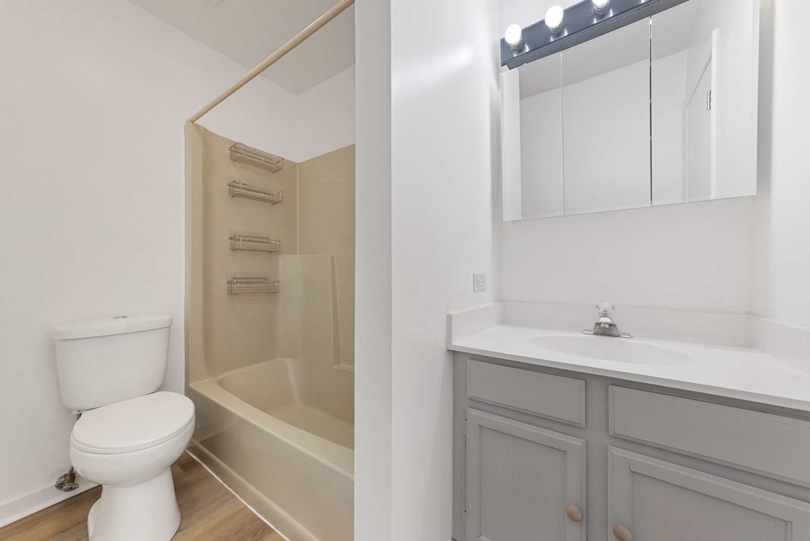 1420 Stonebridge Circle, Unit N3 Wheaton, IL 60189 - Photo 9 of 12 a bathroom with a sink a toilet and shower