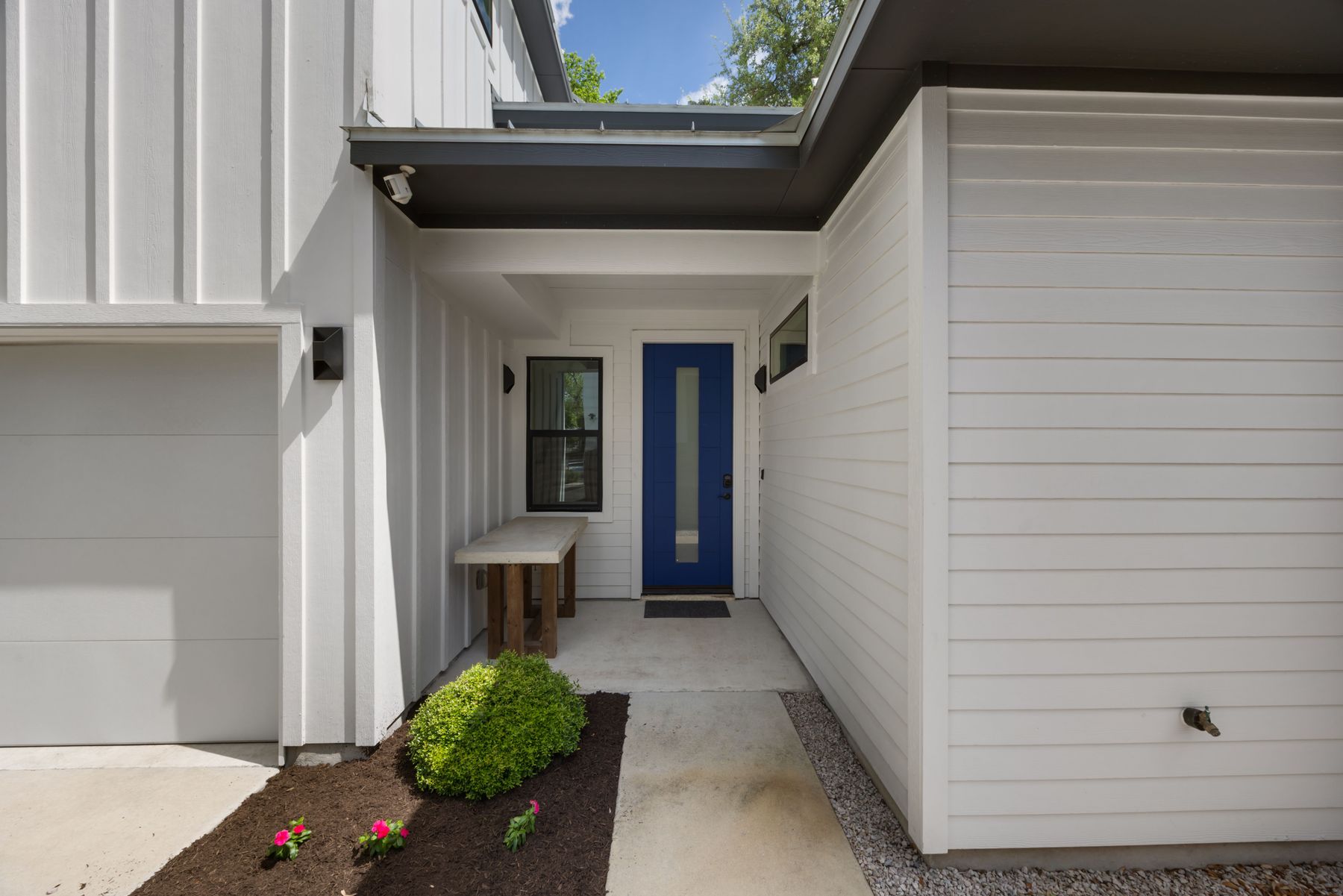 2711 Stacy Lane, Unit 2 Austin, TX 78704 - Photo 24 of 26 Entrance to property featuring board and batten siding and a garage