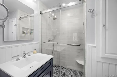 a bathroom with a sink toilet and shower