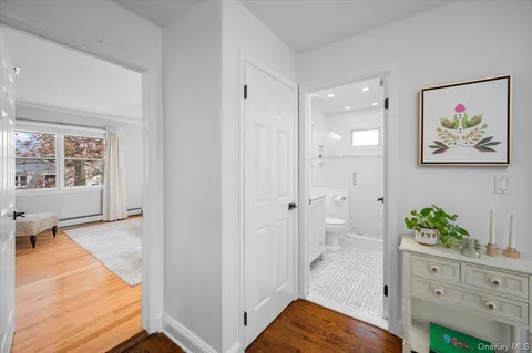 a view of room with window and wooden floor