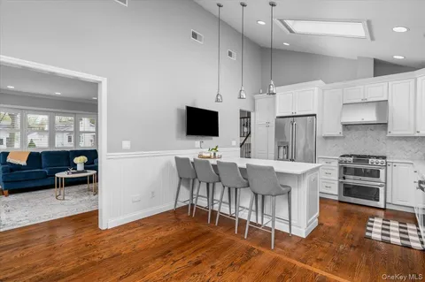 a view of kitchen with cabinets and wooden floor
