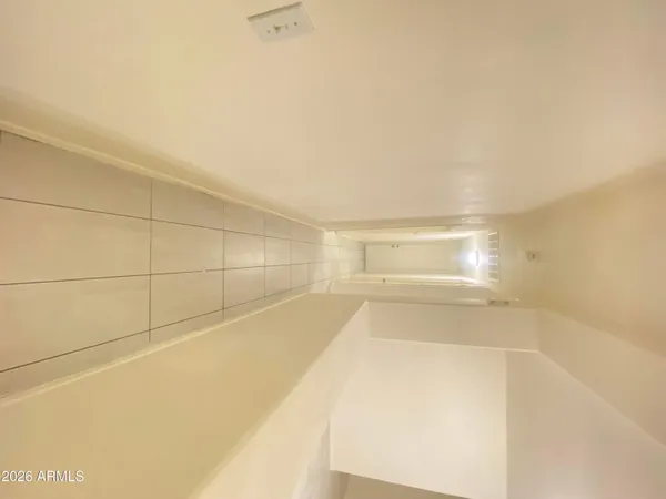 a view of a room with an empty space