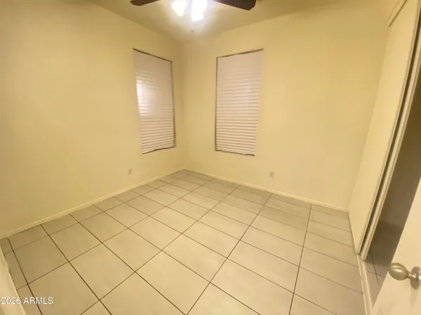 a view of an empty room and a window