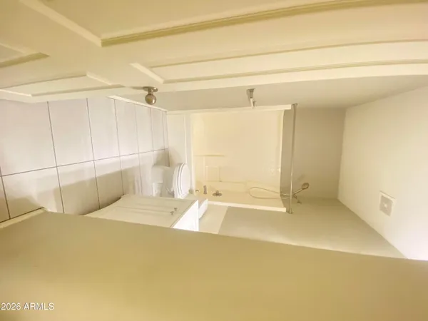 a bathroom with a tub and a shower