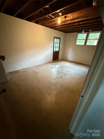 a view of an empty room and window
