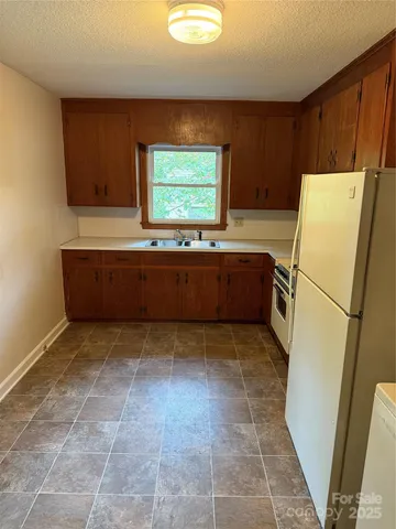 a bathroom with a bathtub and a window