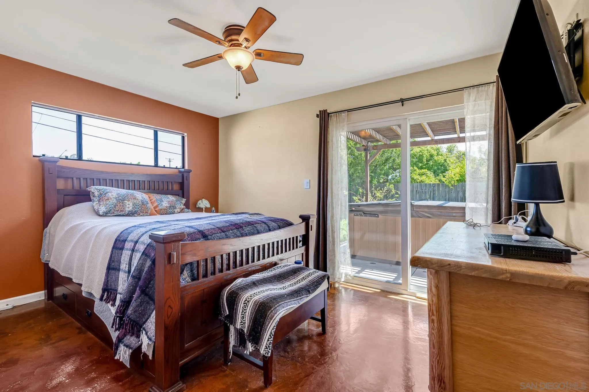 13055 Carriage Road Poway, CA 92064 - Photo 8 of 24 a bedroom with a bed and a flat tv screen on the dresser