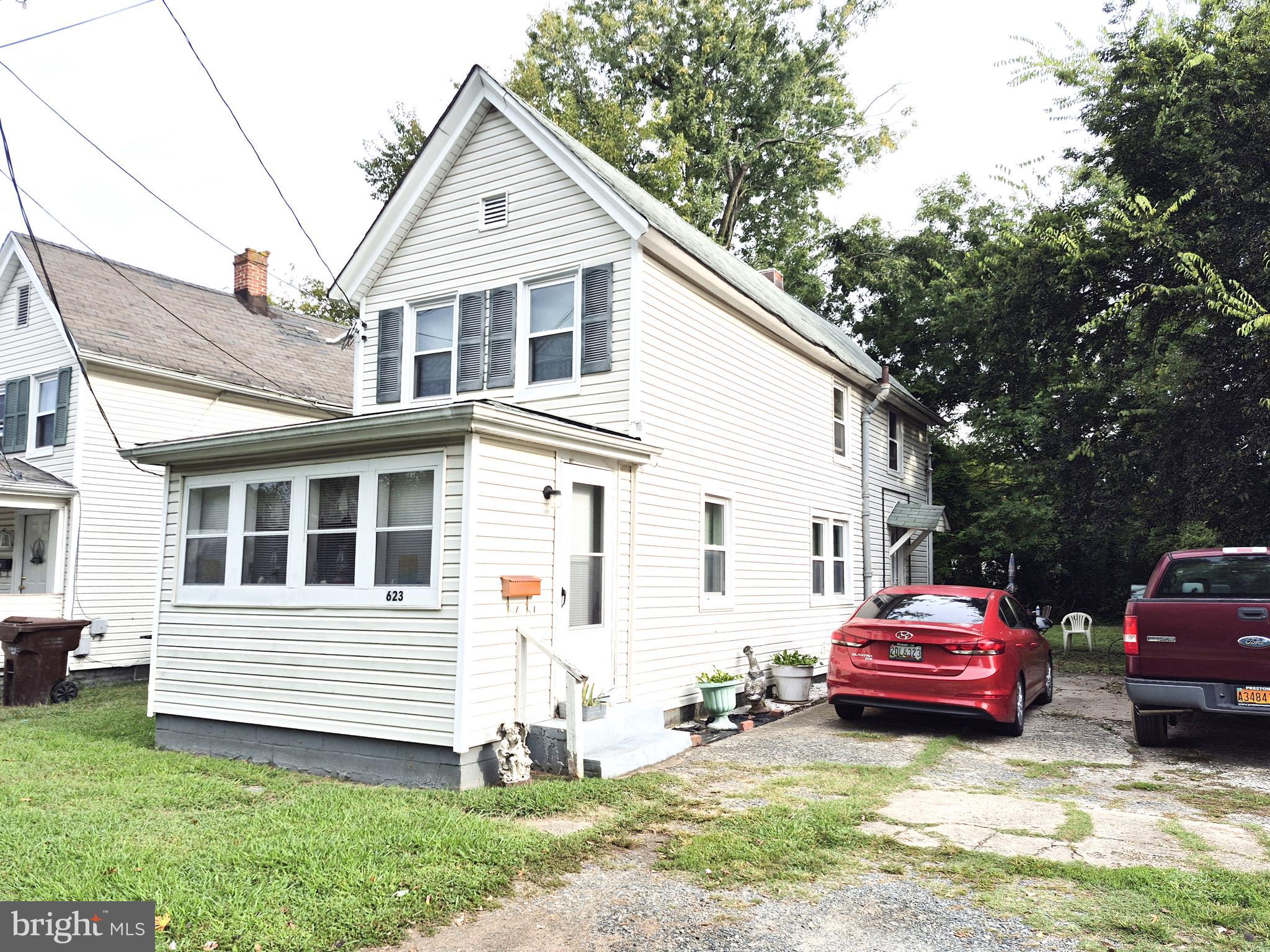 623 Cross Street Cambridge, MD 21613 - Photo 11 of 14 a house view with a garden space