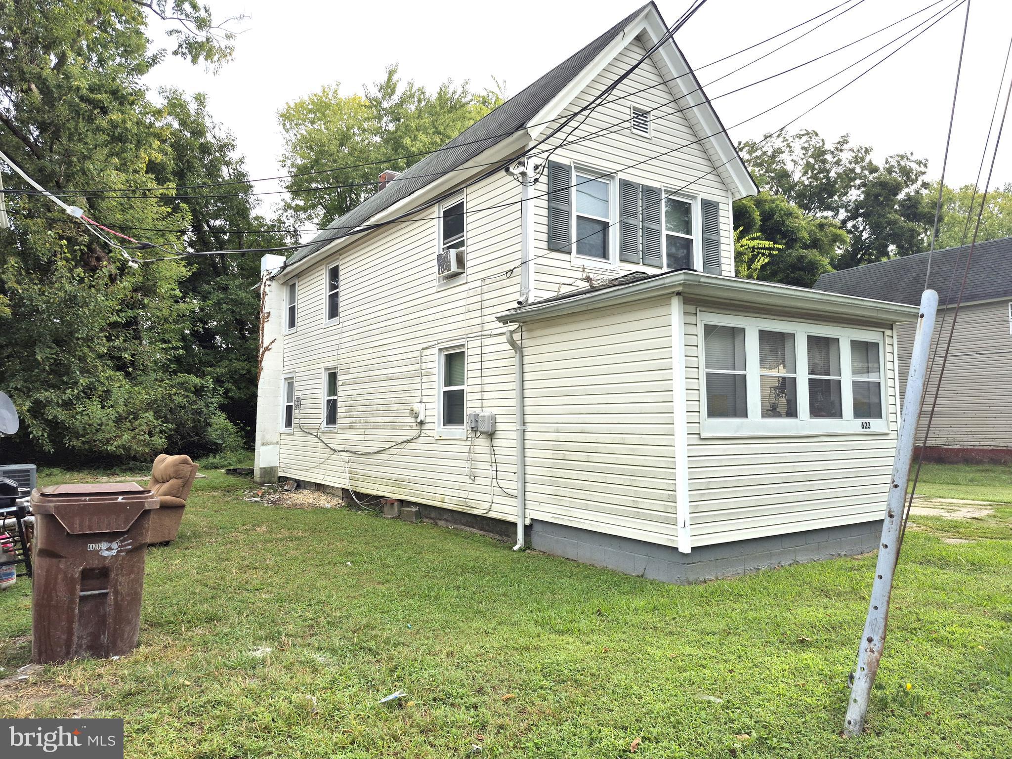 623 Cross Street Cambridge, MD 21613 - Photo 13 of 14 a view of a white house with a yard