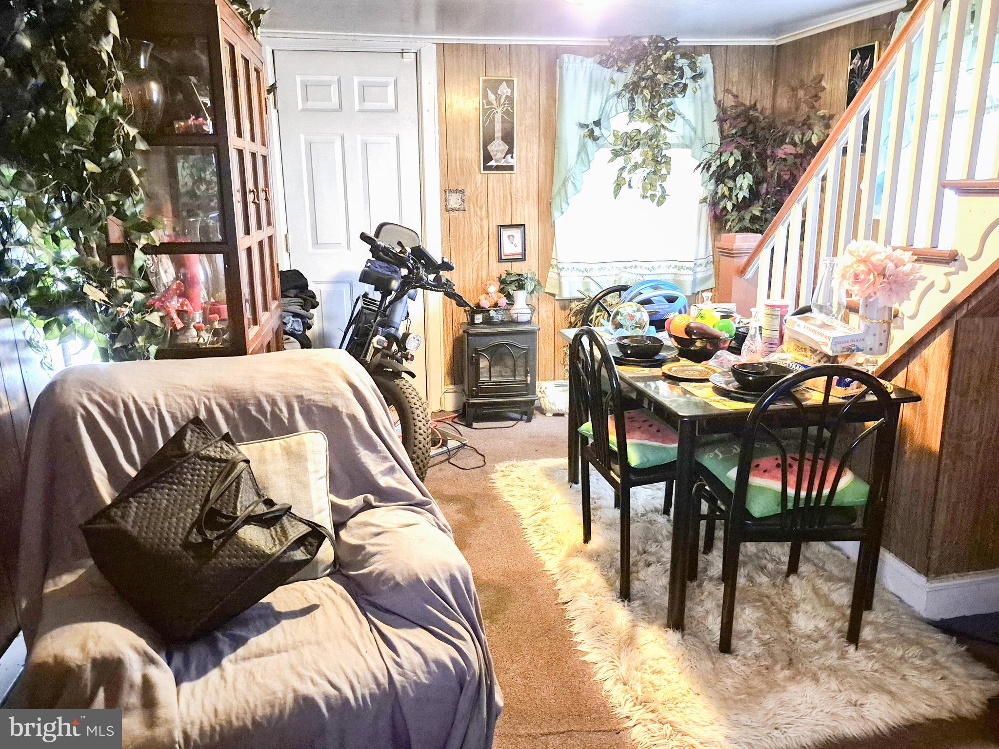 623 Cross Street Cambridge, MD 21613 - Photo 2 of 14 a bedroom with two beds and a large window