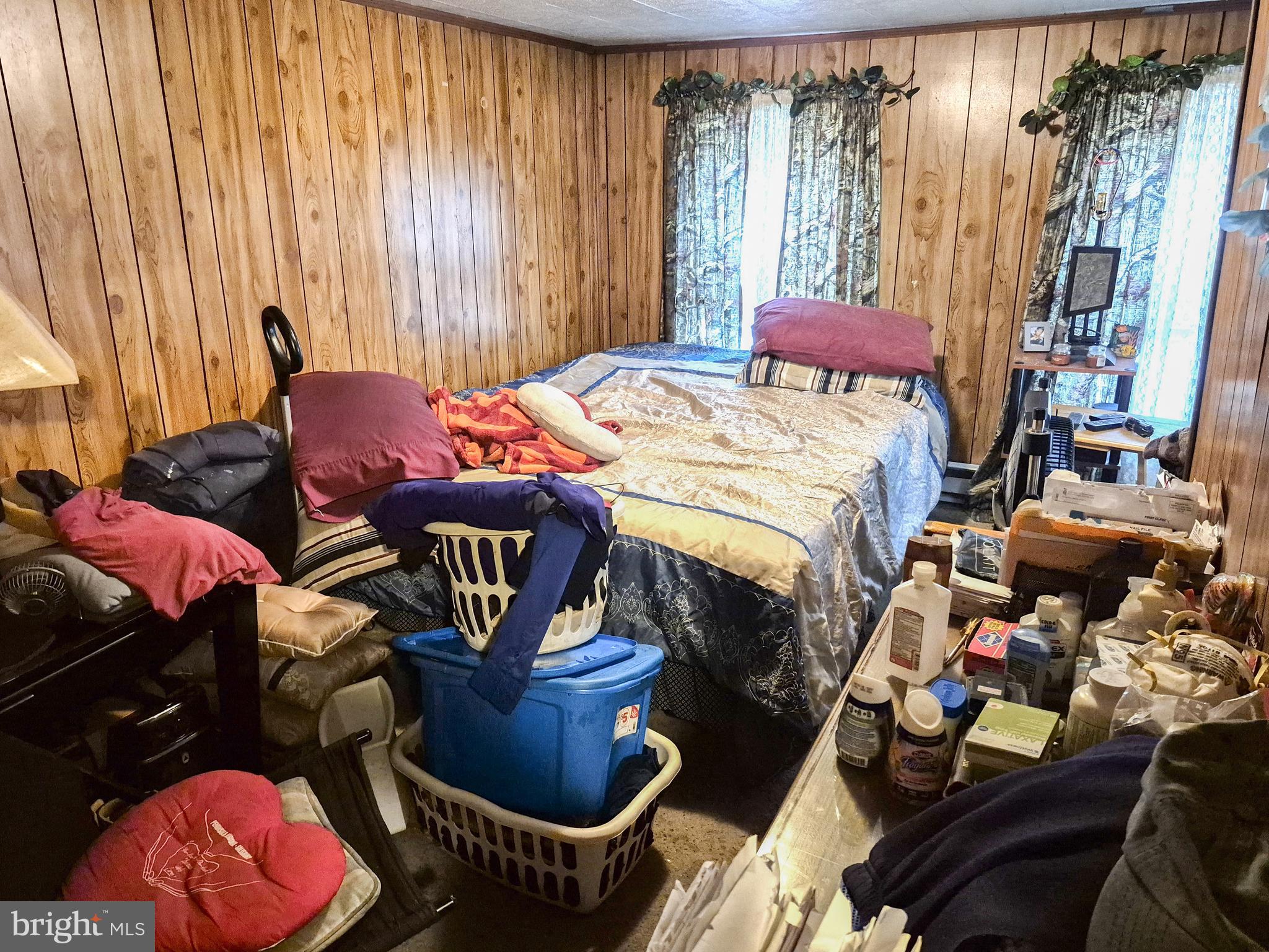 623 Cross Street Cambridge, MD 21613 - Photo 9 of 14 a bedroom with furniture and a window