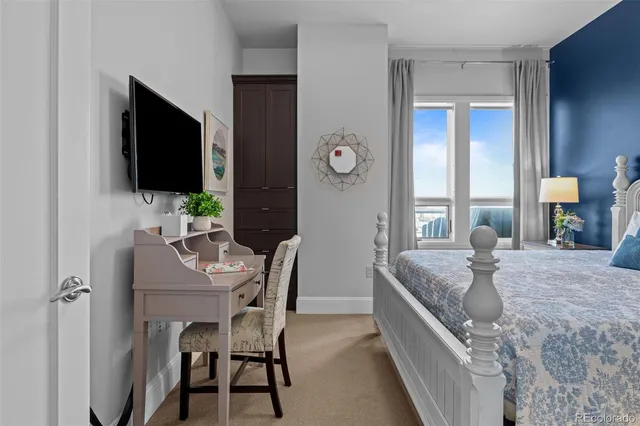 a view of a livingroom with furniture and a flat screen tv