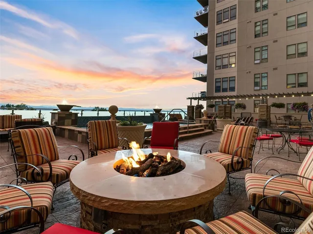 a view of a patio with couches table and chairs