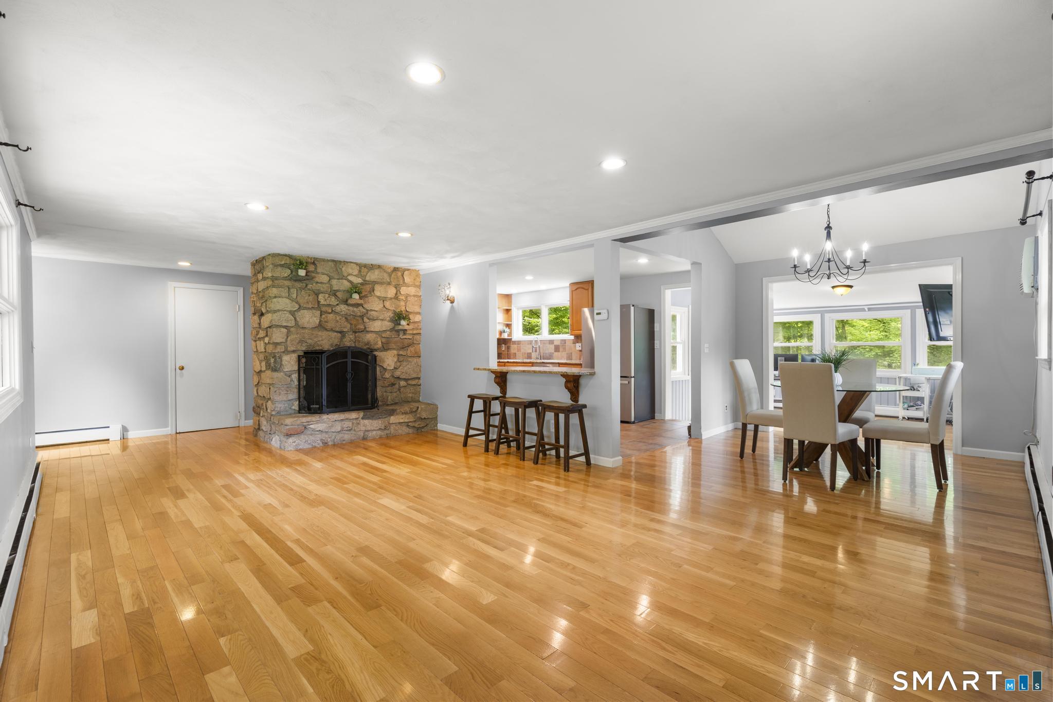 200 Old Huckleberry Road Wilton, CT 06897 - Photo 5 of 24 a view of empty room with furniture and a fireplace