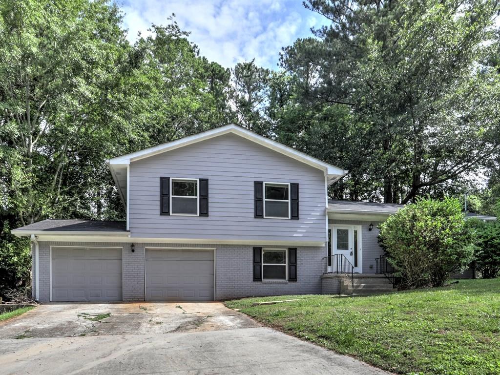 3992 Wedgefield Circle Decatur, GA 30035 - Photo 1 of 1 a house that has a tree in front of the house