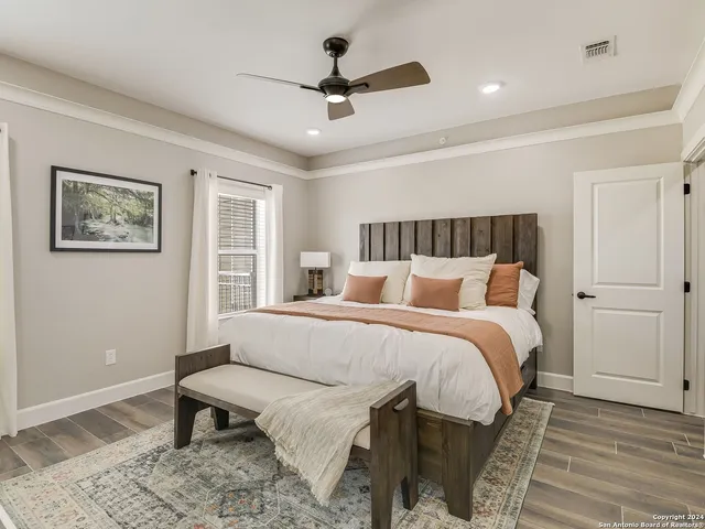 a bedroom with a bed and a table