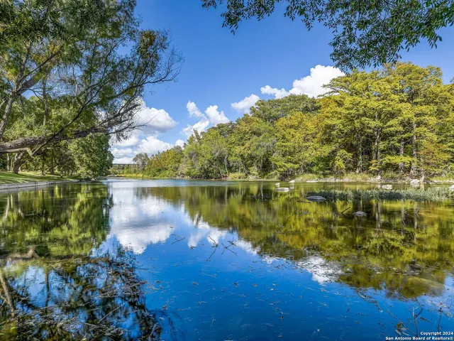 a view of a lake with a building in the background