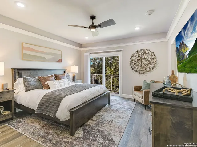 a bedroom with bed and a large window