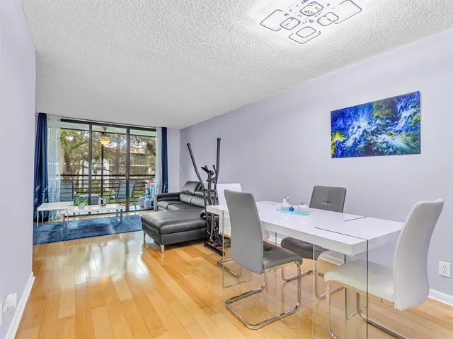 a work room with furniture and a large window