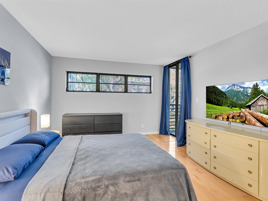 7579 Northwest 79th Avenue, Unit 204 Tamarac, FL 33321 - Photo 19 of 45 a bedroom with a bed and a dresser