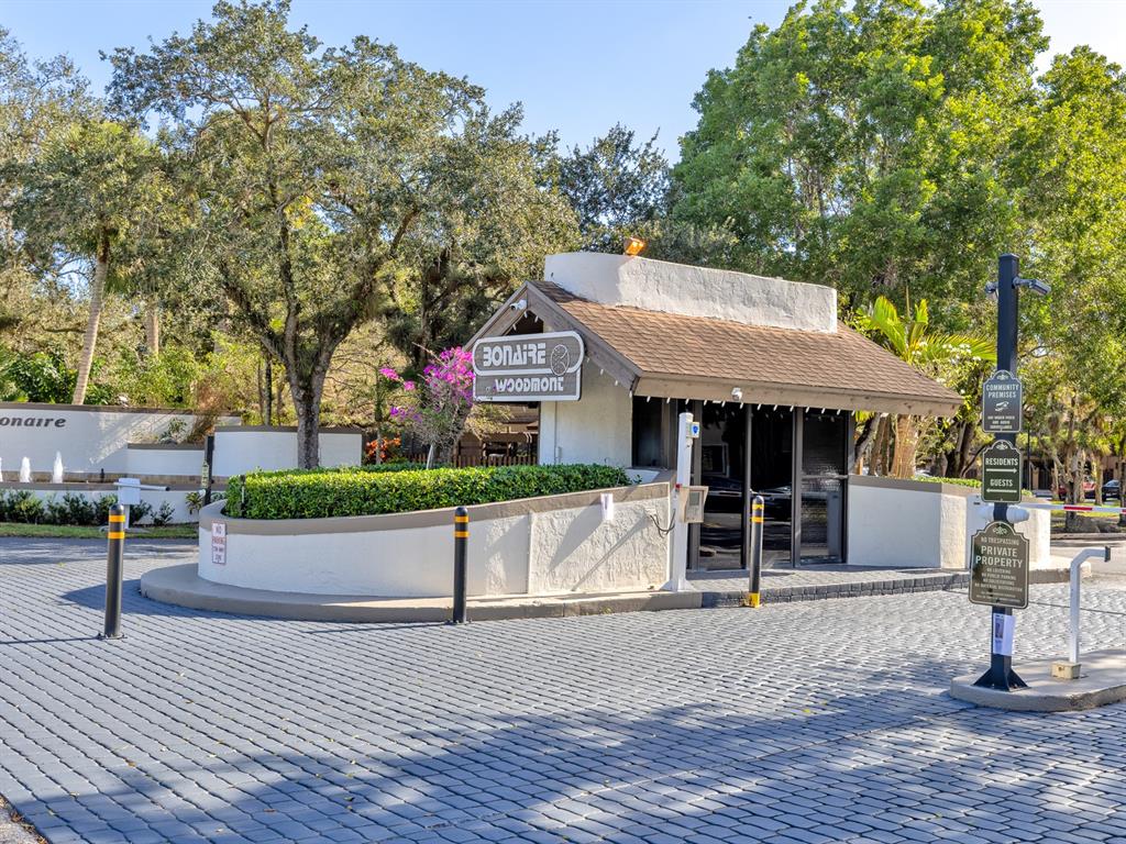 7579 Northwest 79th Avenue, Unit 204 Tamarac, FL 33321 - Photo 2 of 45 a front view of a house with a yard