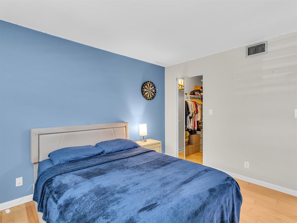 7579 Northwest 79th Avenue, Unit 204 Tamarac, FL 33321 - Photo 24 of 45 a bedroom with a bed and a window