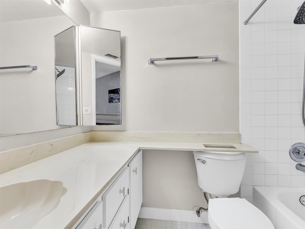 7579 Northwest 79th Avenue, Unit 204 Tamarac, FL 33321 - Photo 27 of 45 a bathroom with a sink toilet and shower
