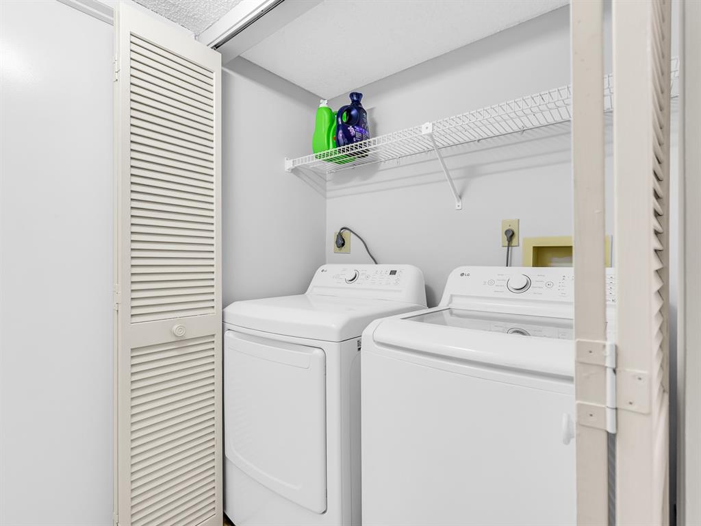 7579 Northwest 79th Avenue, Unit 204 Tamarac, FL 33321 - Photo 28 of 45 a utility room with dryer and washer