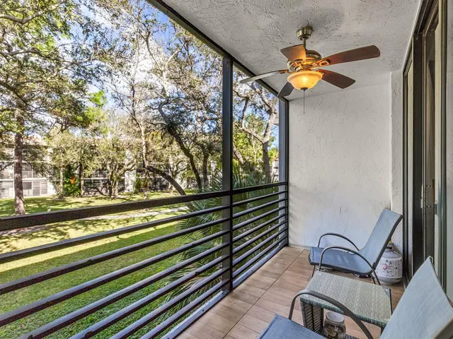 a view of a floor to ceiling window and wooden floor