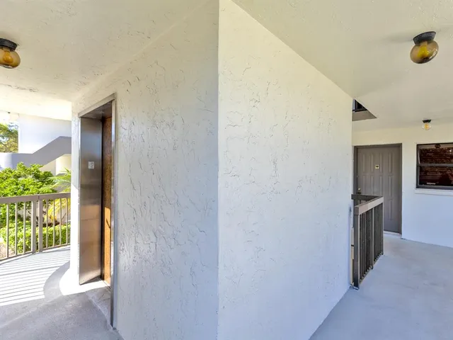 a view of walk in closet with living room