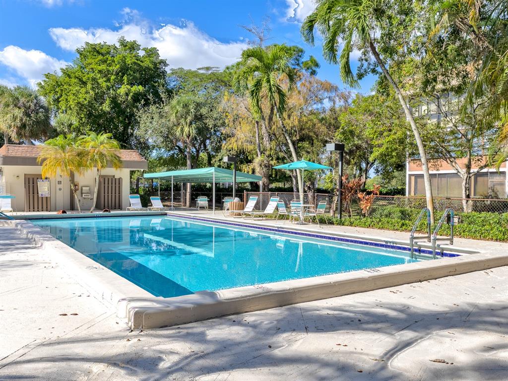 7579 Northwest 79th Avenue, Unit 204 Tamarac, FL 33321 - Photo 37 of 45 a view of a house with a swimming pool